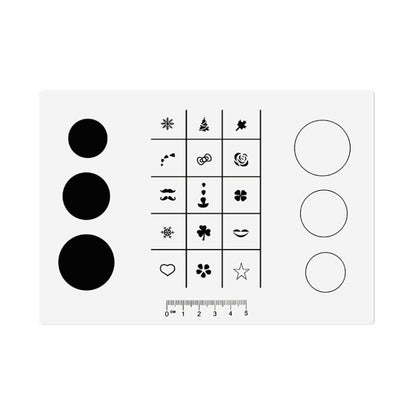 Silicone nail stamping pad with black nail-art symbols and three large circular marks