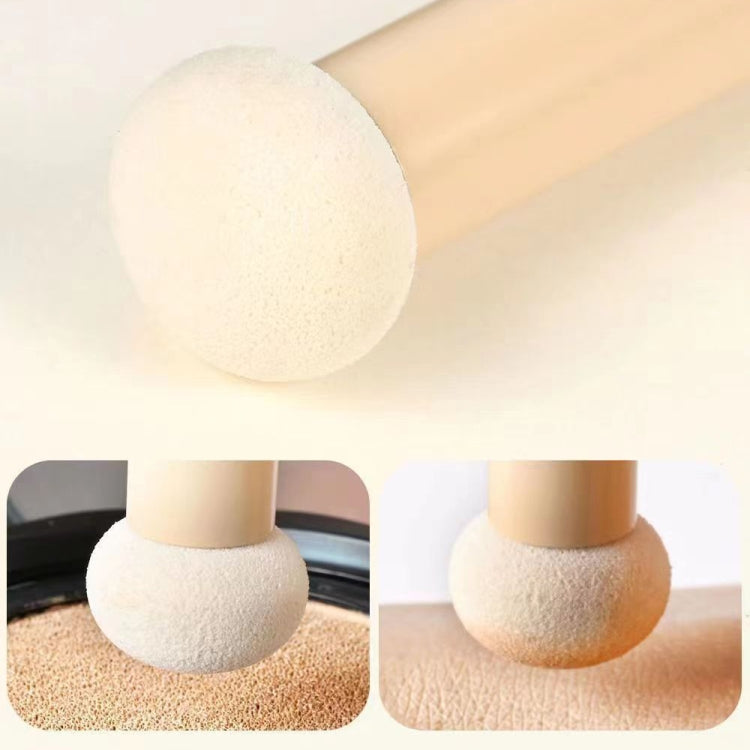 Round sponge applicator tip on a brush handle for makeup blending