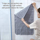 Gray PVC non-slip bath mat secured to wall with suction cup