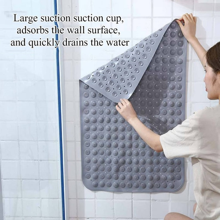 Gray PVC non-slip bath mat secured to wall with suction cup