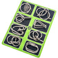 Nine-link metal puzzle set with shiny interlocking pieces on a green card