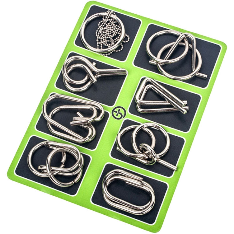 Nine-link metal puzzle set with shiny interlocking pieces on a green card