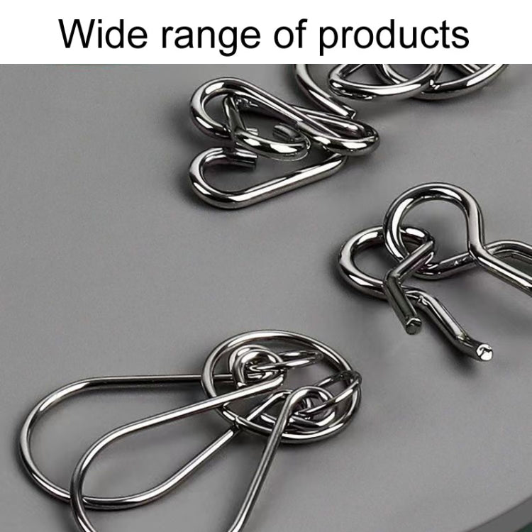 Close-up of shiny interlocking metal puzzle links for a nine-piece challenge