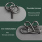 Close-up of a metal keyring-style link and round connected puzzle pieces