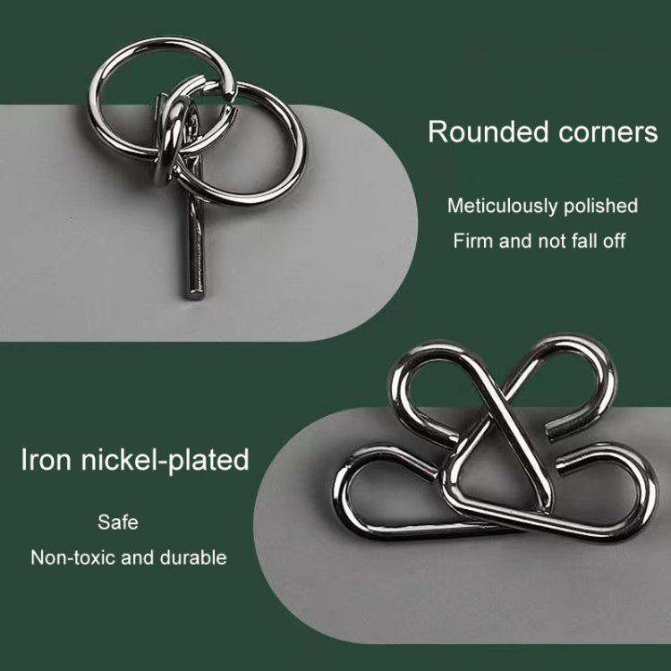 Close-up of a metal keyring-style link and round connected puzzle pieces