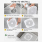 White silicone drain strainer pad being positioned over a sink drain