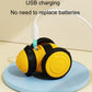 Yellow and black motorized cat toy charging with USB cable connected
