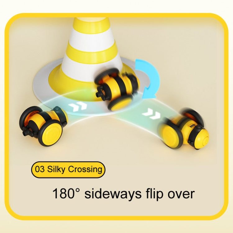 Yellow and black motorized cat toy upside-down flipping motion with arrow graphics
