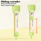 Green cat feeding spoon with sliding extruder for single-handed squeeze dispensing.