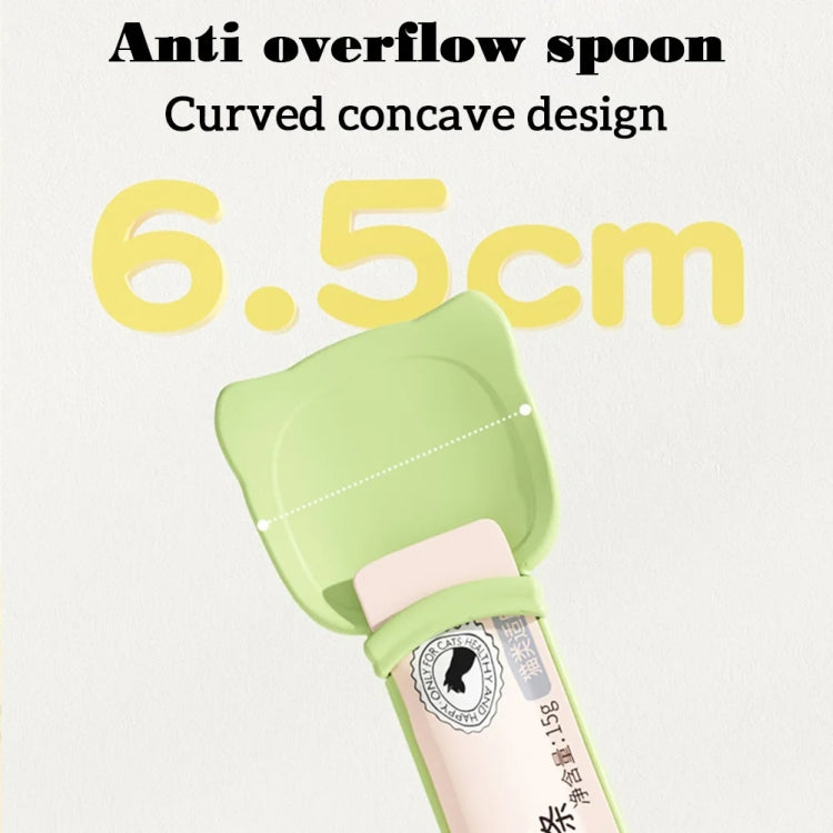 Green cat anti-overflow feeding spoon with curved scoop design for controlled dispensing.