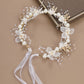 White pearl flower wreath hair band with lace ribbons and gold accents
