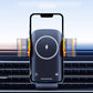 Black wireless charging phone holder mounted on car air vent with glowing ring