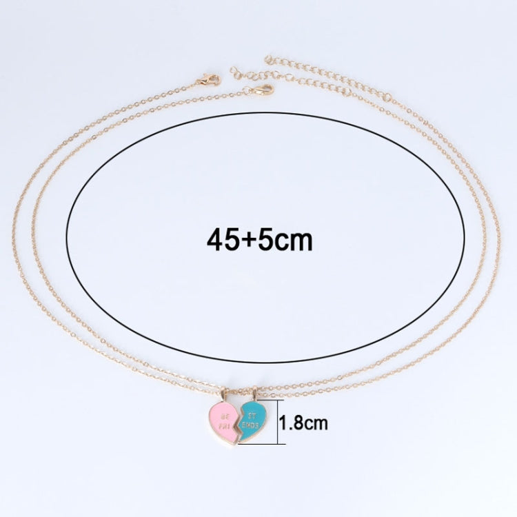 Layered gold-tone chain necklace with pink and blue heart pendants