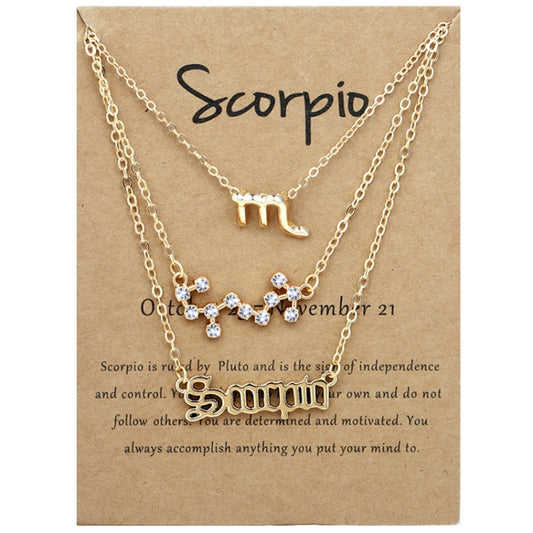 Scorpio zodiac necklace set with layered gold chains and small crystal charms