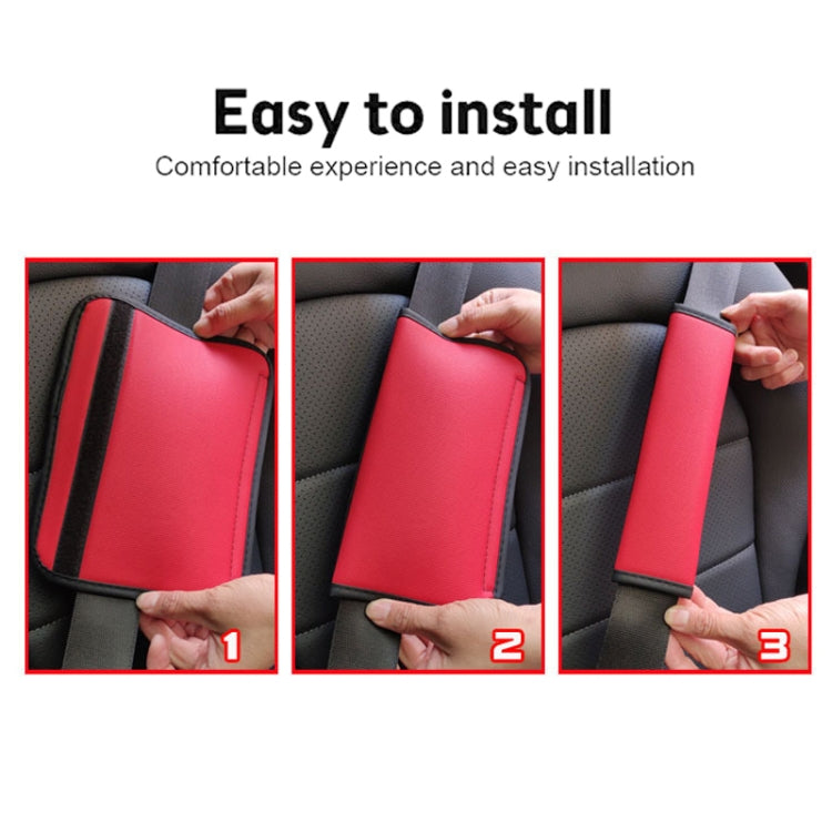Red seat belt shoulder pad cover being installed on a car seatbelt
