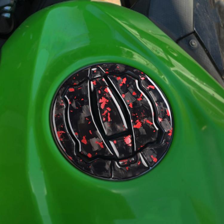 Black fuel tank cap decoration sticker with red splatter graphic on green tank