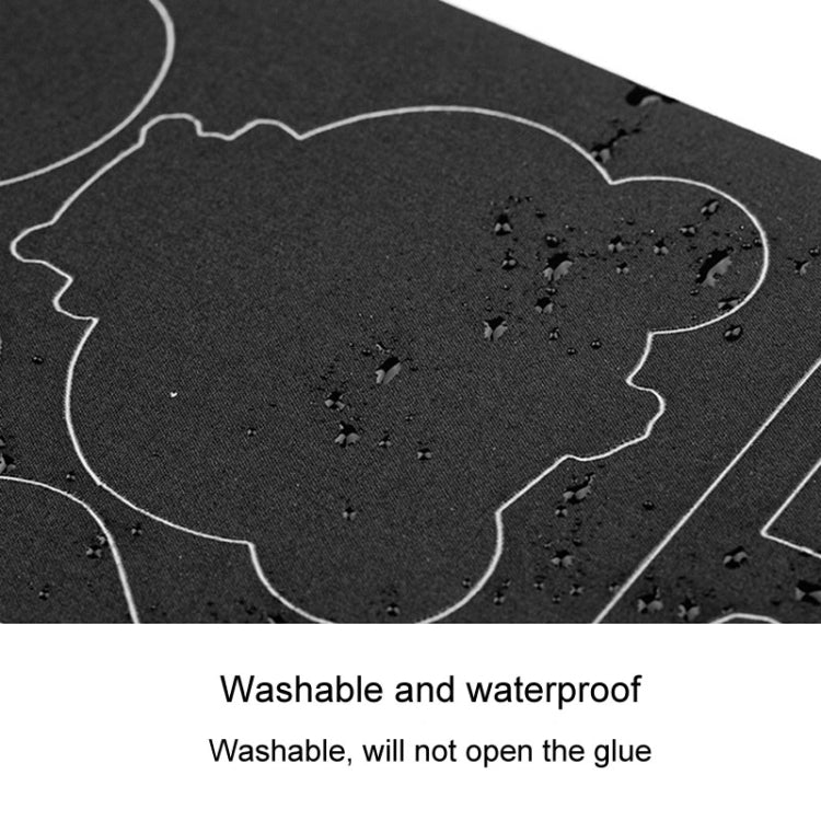 Black fabric repair patch sticker sheet with outlined shapes and water-bead texture