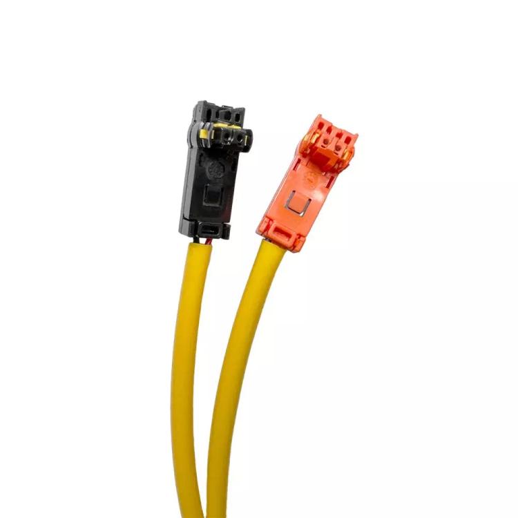 Yellow clock-spring wiring harness with orange and black electrical connectors