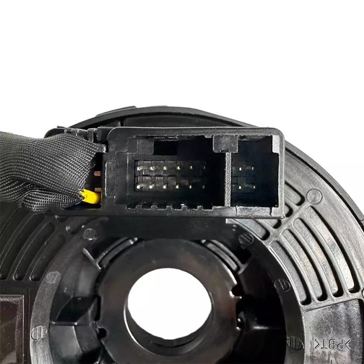 Clock spring coil connector view with multi-pin socket and yellow wire lead