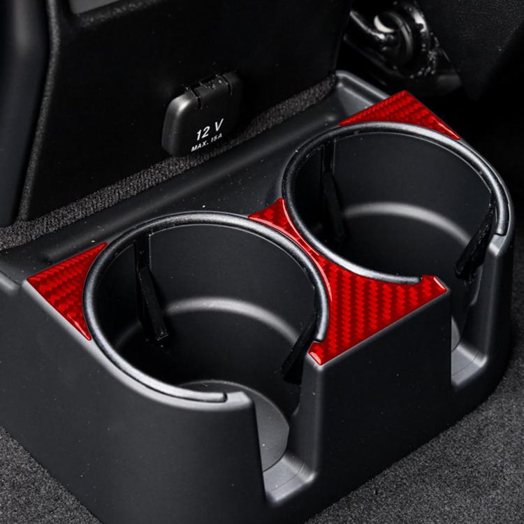 Red carbon-fiber rear cup holder stickers applied around two cup holders