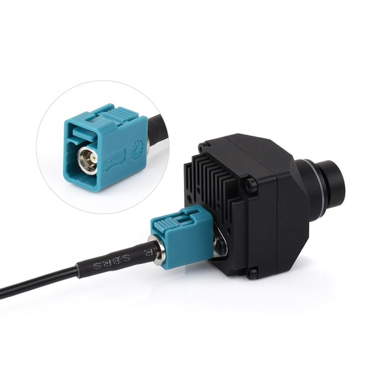 Coaxial cable plug with blue Fakra female connector and black housing, side view