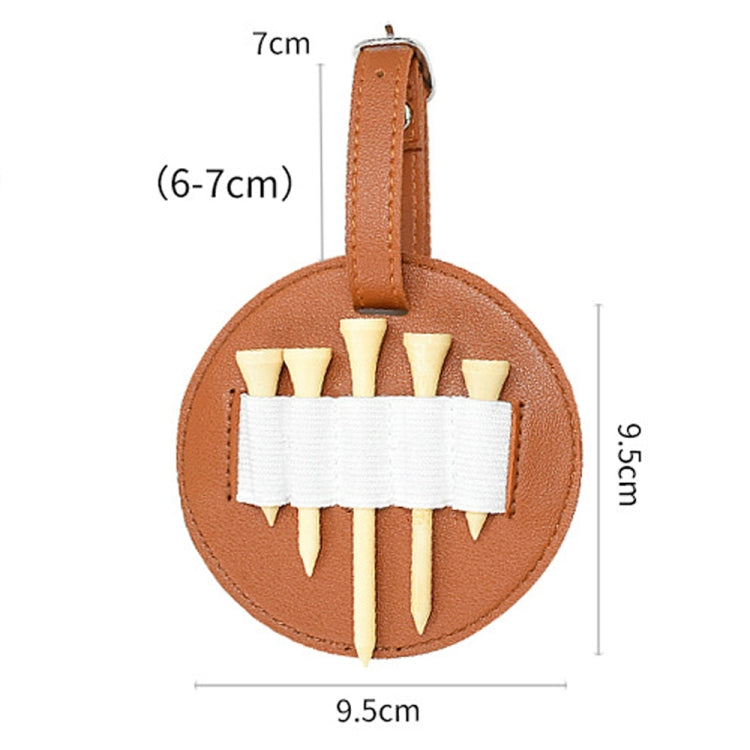 Brown leather oval spike insert storage pouch with white elastic band holding spike inserts.