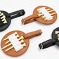 Set of leather spike insert pouches in brown and black, each with elastic slots and buckle straps.