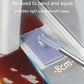 Automatic paper mop reaching tight corners under cabinets with a white cloth pad