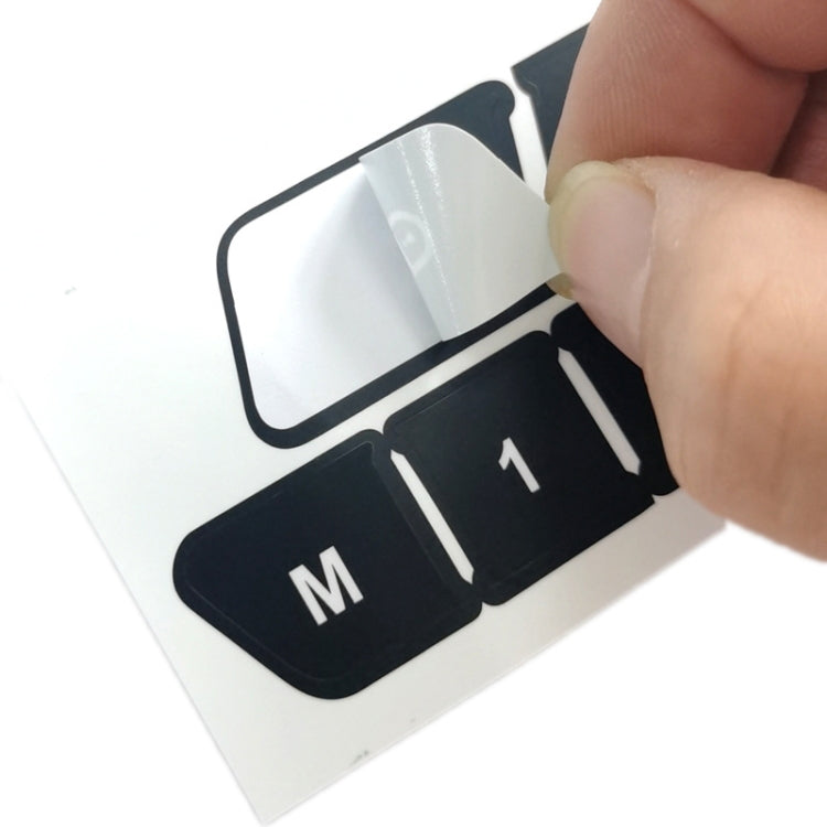 Door switch button repair sticker being applied to a car door switch panel