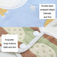 Newborn gauze bib with snap buttons and double-layer wrapped edges close-up
