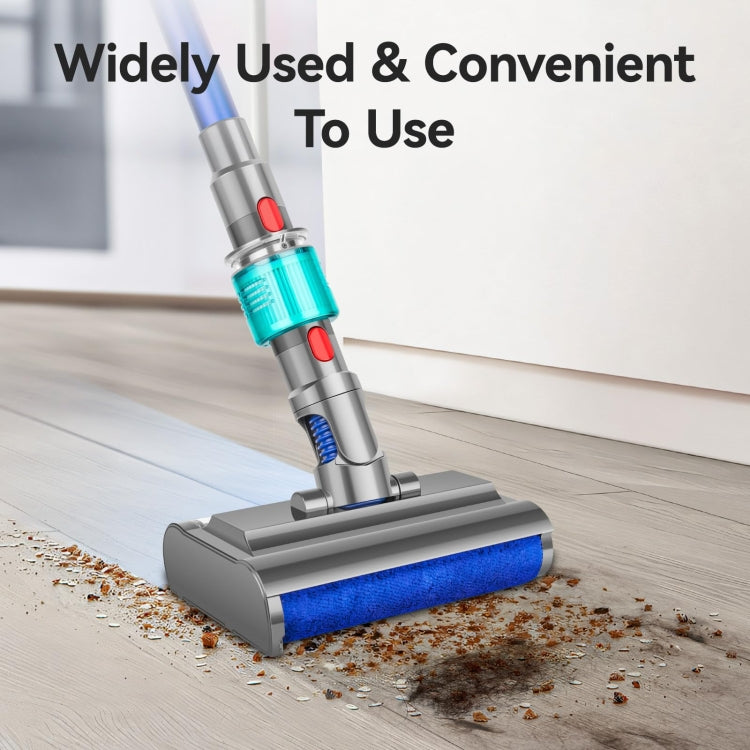 Wet vacuum mopping head with blue roller brush and gray base on dusty floor.