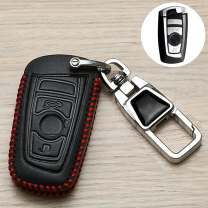 Black leather-style key fob cover with red stitched edges and metal keyring clasp