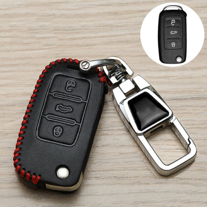 Black Volkswagen key fob cover with red stitching, metal carabiner keychain, button panel