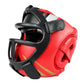 Red boxing sparring helmet with black chin guard and face cage