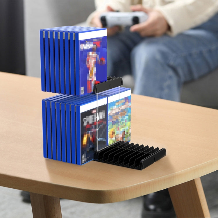 Two-tier wall CD storage bracket holding game discs on a tabletop