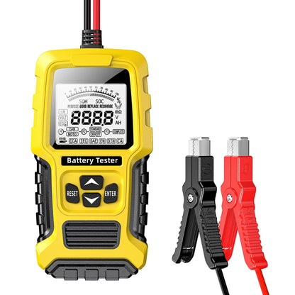 Yellow battery tester with LCD screen, reset/enter buttons, and attached cable leads