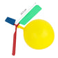 DIY balloon helicopter toy with yellow balloon body and green, blue, red propeller blades