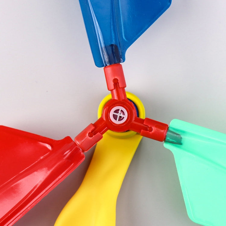 Close-up of balloon helicopter rotor connector in red with blue and green propeller blades