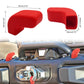 Red two-piece trailer hook cover caps installed on a front bumper tow hook area.