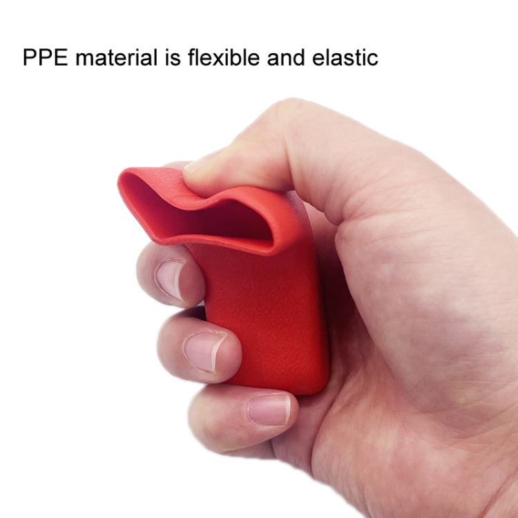 Red flexible trailer hook cover cap held in hand, curved opening style.