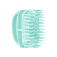 Mint green silicone scalp shampoo brush with soft massage teeth, handheld