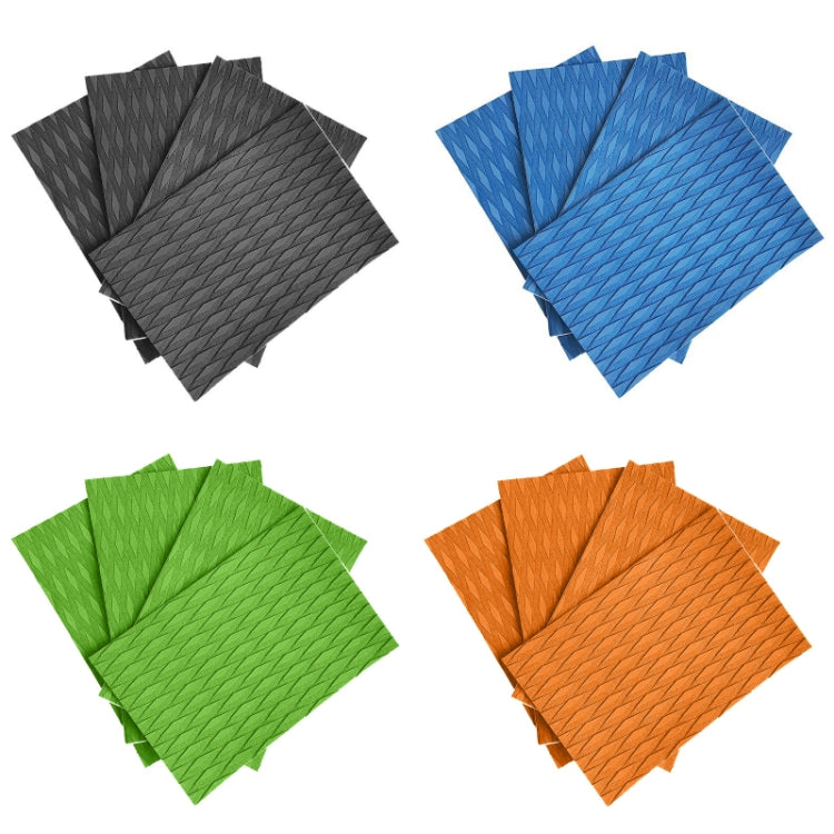 Set of EVA surfboard anti-skid pads in black, blue, green, and orange, textured sheets