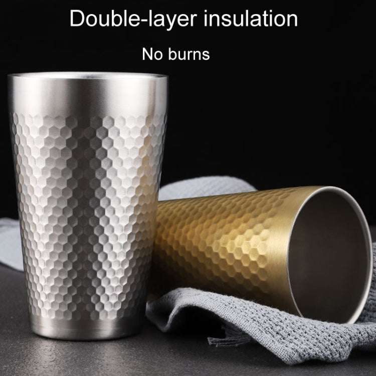 Silver hammered double-layer mug with rolled gold mug beside it