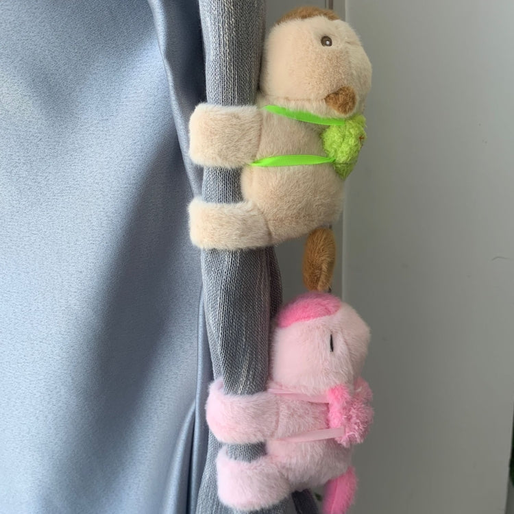 Plush snap-ring bracelets on curtain: beige animal with green band, pink dolphin