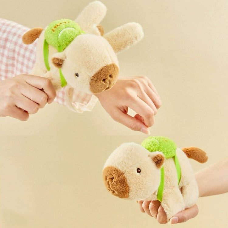 Beige plush animal snap ring bicycle accessory with green strap and long ears