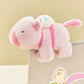 Pink plush animal snap ring bicycle accessory with blue-striped tail and green straps