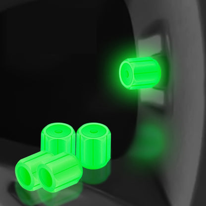 Green luminous car tire valve caps set, glowing at the wheel valve stem
