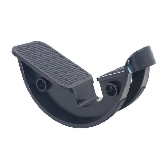 Black ankle stretch massage pedal with textured top pad and curved base
