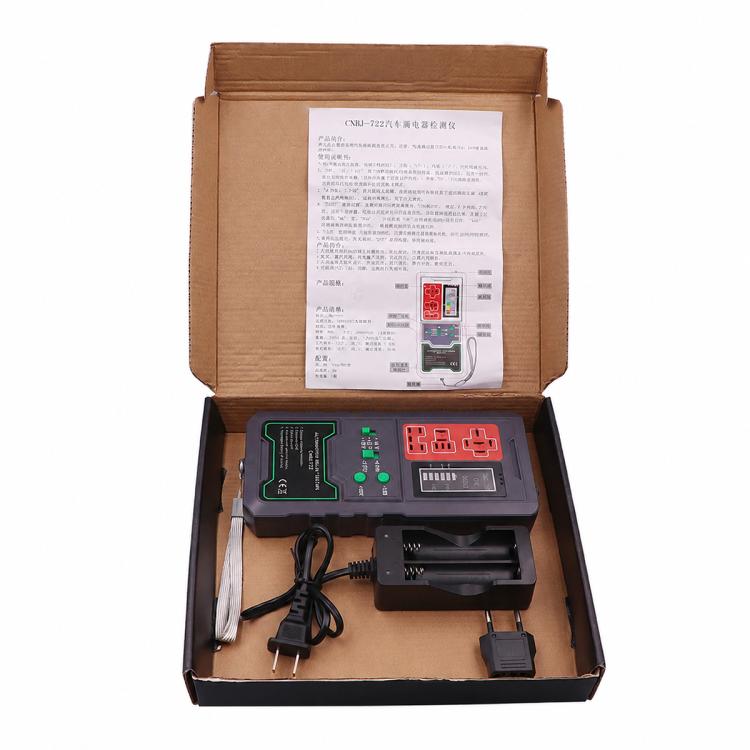 Automotive relay tester kit in open box with tester, cables, and instruction paper