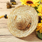 Tan woven straw pet sun hat with yellow tie and black adjustable clips